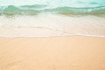 Travel Nature Concept, Sea Sand Background Blue Water at Coast Season Summer Tropical Ocean Beautiful Wave Seascape Vacation Smooth Wallpaper Island Outdoor Tropical Coast Sandy Nature Landscape.