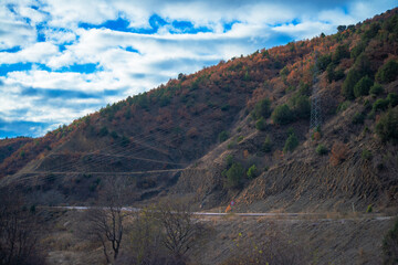 Powerful Pathways: Mountain, Road, and Distant Cables