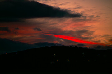 Crimson Embrace: Red Sunset at Twilight