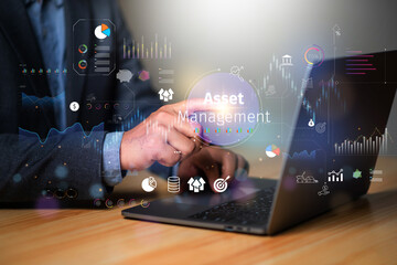 Asset management concept, Businessman using laptop and touch asset management Icon  on virtual display. Financial Property Digital assets.