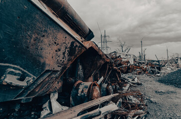 burnt tank and destroyed buildings of the Azovstal plant shop in Mariupol