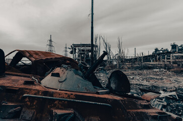 burnt tank and destroyed buildings of the Azovstal plant shop in Mariupol