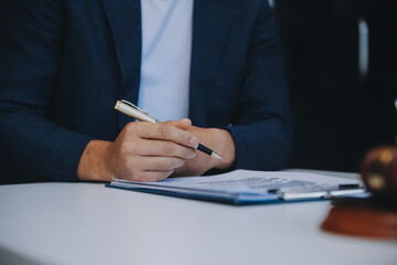 Consultation and conference of Male lawyers and professional businesswoman working and discussion having at law firm in office. Concepts of law, Judge gavel with scales of justice.