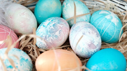 Easter eggs in a basket. Easter composition. Holiday concept.