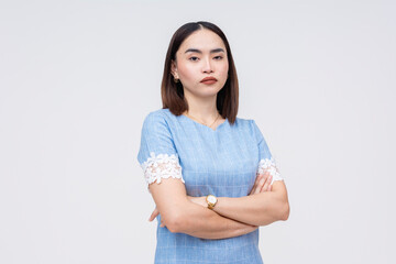 Unimpressed Asian woman with crossed arms isolated on white - obrazy, fototapety, plakaty