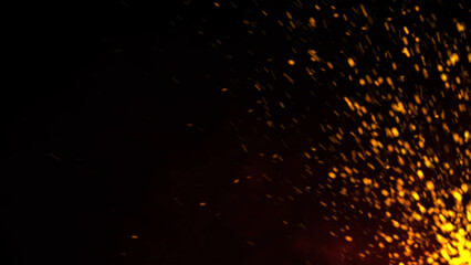 Red Glowing Ember Particles, Dark Glitter Fire Lights Rise Amidst Smoke, Fog, and Misty Texture Over Black Background. Experience the Intensity of Burning Sparks in this Abstract Composition
