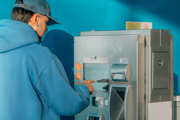 young man at bank teller or payment