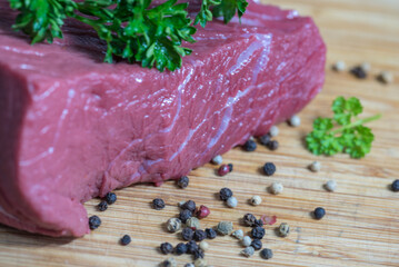 Raw beef meat on a cutting board - 764619340