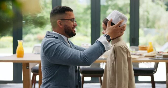 Father, hug and muslim kid in home, dressing and happy family bonding together for relationship. Islam, smile and dad embrace child in hat to help button clothes for love, care and support on Eid