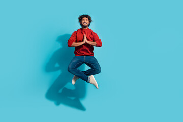 Fototapeta na wymiar Full length size photo of guy jumping with clasped palms in lotus pose pleading praying for god help isolated on cyan color background