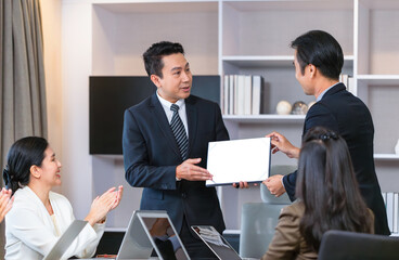 Employee gets a certificate of achievement, Businesspeople with certificates in the office, Manager give appreciation certificate to employees for achievement