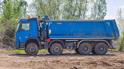Big Blue Tipper Truck at Road Construction Site