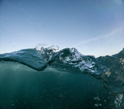 Dynamic underwater view with glistening water surface