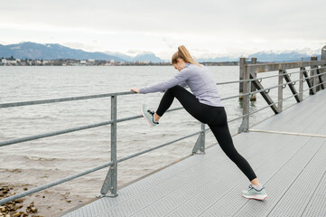 Outdoor stretching exercises by a lakeside