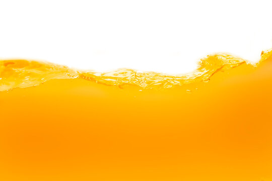 Close up bright orange juice texture for health and nature waves