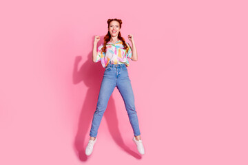 Full size photo of overjoyed eccentric girl dressed colorful blouse jeans pants flying shout win bet isolated on pink color background