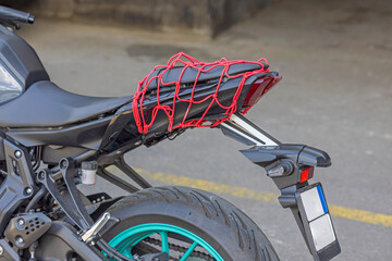 Red Bungee Cargo Net at Sports Motorcycle Seat