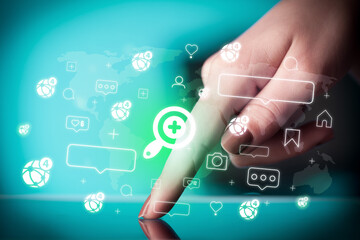 Close-up of a hand using tablet, social media concept