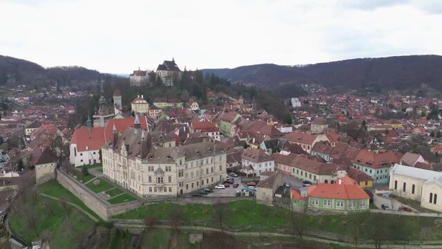 4K Aerial orbiting shot of the Sighisoara Citadel in Mures, Romania