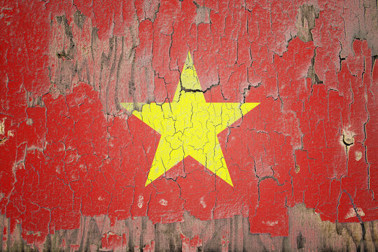 Vietnam flag painted on the cracked wall