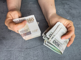 100 200 oln money in woman's hand. Money Polish zloty, financial concept