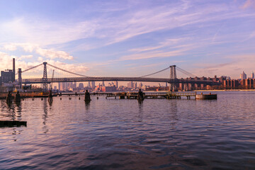 Fototapeta na wymiar Brooklyn Bridge with lower Manhattan skyline in New York City at night, USA. Long exposure at night
