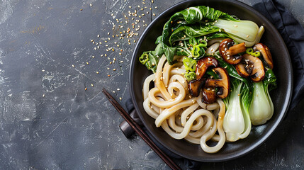 Asian vegetarian food udon noodles with baby bok choy, shiitake mushrooms, sesame and pepper close-up on a plate. horizontal top view  - obrazy, fototapety, plakaty