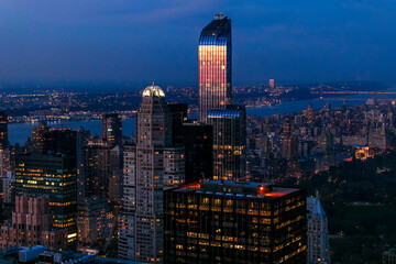 Fototapeta na wymiar New York Manhattan view from One World Trade Center. sunset view with financial buildings city light. Empire State building on sunset 