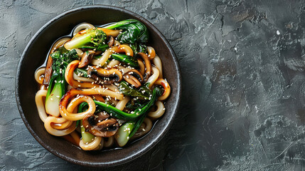 Asian vegetarian food udon noodles with baby bok choy, shiitake mushrooms, sesame and pepper close-up on a plate. horizontal top view 