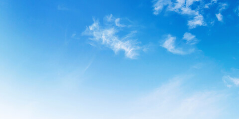 sky is blue and clear with a few clouds scattered throughout