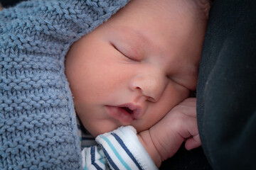 Cute newborn baby sleeping. Beautiful portrait of little child close-up. High quality photo