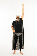 Man in Black and White Superhero Outfit With Arms Raised Ready to Fly