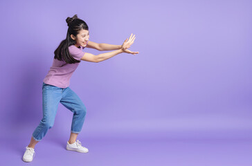 Fototapeta na wymiar Photo of young Asian girl on purple background