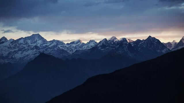 Beautiful sunrise in the high altitude mountain range of Tibet and Nepal. Himalayan sunrise with clouds. snowy ice capped summits