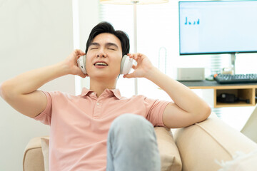 Fototapeta premium Photo of young Asian man at home