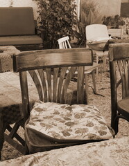 Inviting Garden Chairs With Sepia Tones. Homely Backyard Setting Offering A Place To Relax