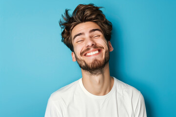 Fototapeta premium A man makes funny, sad, horrible grimaces, makes a face on a coloured background