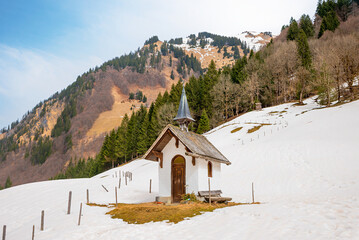 small chapel Alpe Oberau, trettach valley, snowy slope. alpine landscape allgau alps