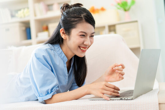 Photo of young Asian girl at home