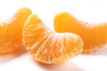 Fresh tangerines slices isolated on white background