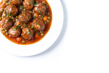 Meatballs, green peas and carrot with tomato sauce isolated on white background. Top view. Copy space