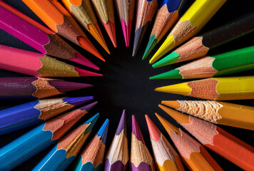 Fototapeta premium Colored pencils in circle on black background