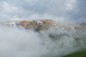 View of the summit of mountain on the spring fog in the Marche region, Italy - 764699790