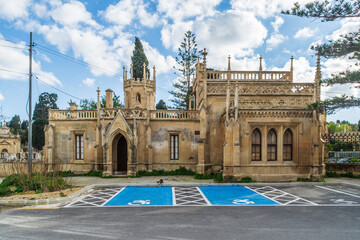 Paola, Malta - January 28th 2022: The Gatehouse at the entrance of the Santa Maria Addolorata Cemetery also known as the Addolorata Cemetery.  - obrazy, fototapety, plakaty