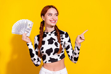 Photo of funky impressed lady dressed cowskin print top holding cash fan pointing empty space...