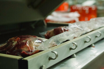 Bags of frozen meat on a tray.