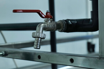 Ball valve on the drain pipe on pipeline.