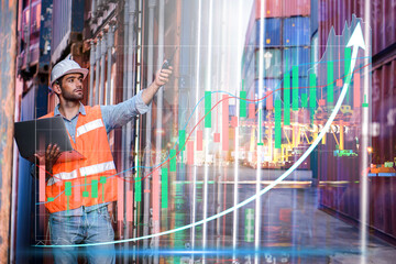 Confident man engineer wearing white safety helmet with grow up stock graph using computer laptop check for control loading containers box from Cargo freight ship for import and export, transport	
