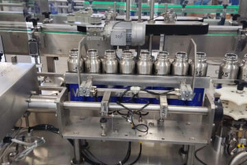 Conveyor line for production of thermoses. Industrial production of metal containers.