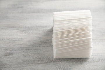 Stack of napkins on the white table.